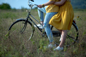 Asian couple on bicycle