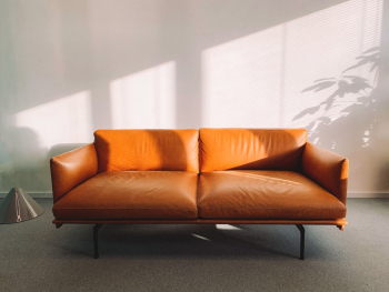 2-seat Orange Leather Sofa Beside Wall 2-seat Orange Leather Sofa Beside Wall
