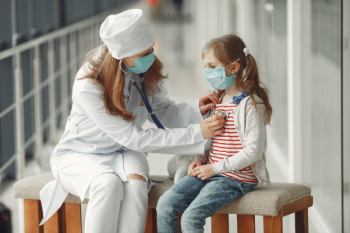 A doctor woman is examinating a child with stethoscope Free Photo A doctor woman is examinating a child with stethoscope Free Photo