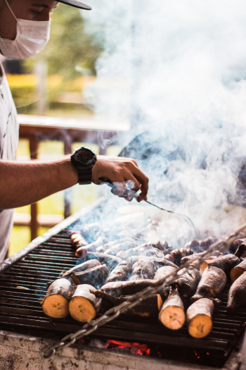 A Man Grilling Bananas A Man Grilling Bananas