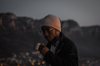 A Man Holds A Tin Cup A Man Holds A Tin Cup