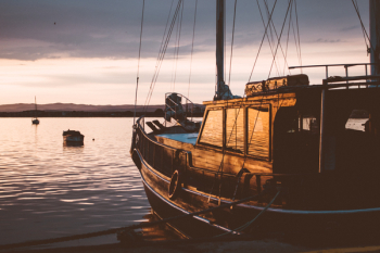 A sailing boat at sunset A sailing boat at sunset