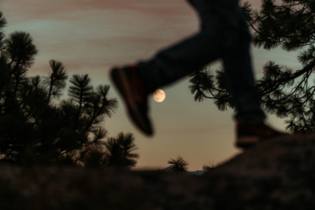 A sunset in Yosemite National Park gives the perfect backdrop for dramatic silhouettes. I caught this guy walking in just the right spot, where it looked like he was kicking the moon. I then asked him to see if he could pose a bit more in that spot, but the first, unintentional picture was the best in the end.