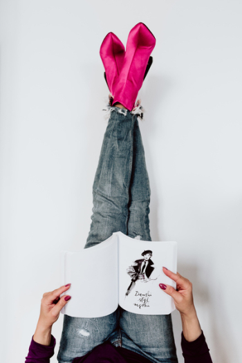 A woman in pink boots and blue jeans A woman in pink boots and blue jeans