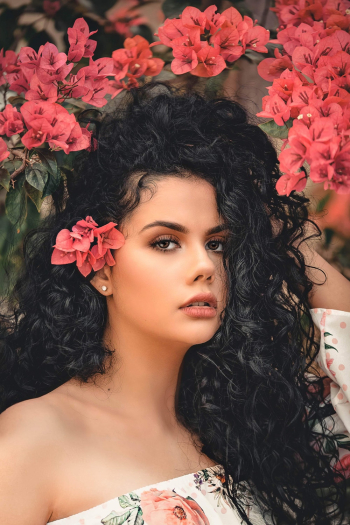A Woman With A Curly Black Long Hair A Woman With A Curly Black Long Hair