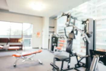 Abstract blur fitness equipment in gym Abstract blur fitness equipment in gym