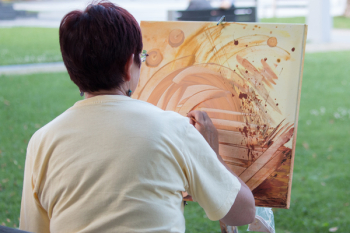 Abstract painting by woman outdoors Abstract painting by woman outdoors