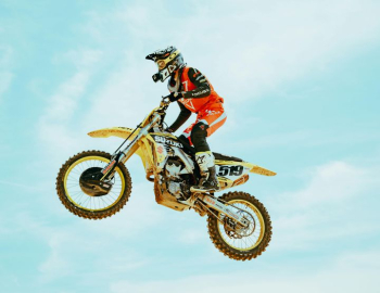 Action-Packed Motocross Rider in Midair Action-Packed Motocross Rider in Midair