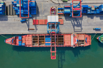 Aerial Photo of Cargo Ship Near Intermodal Containers Aerial Photo of Cargo Ship Near Intermodal Containers