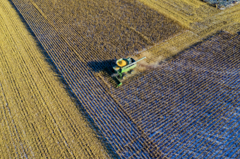 Aerial Photo Of Milling Truck On Field Harvesting Crops Aerial Photo Of Milling Truck On Field Harvesting Crops