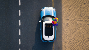 Aerial Photography of Blue Car on Road