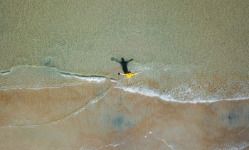 Aerial Photography of Man on Shallow Water Aerial Photography of Man on Shallow Water