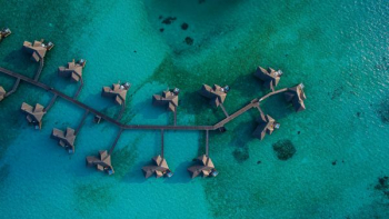aerial photography of resort villa on water aerial photography of resort villa on water