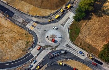 aerial photography of road intersection with vehicles aerial photography of road intersection with vehicles