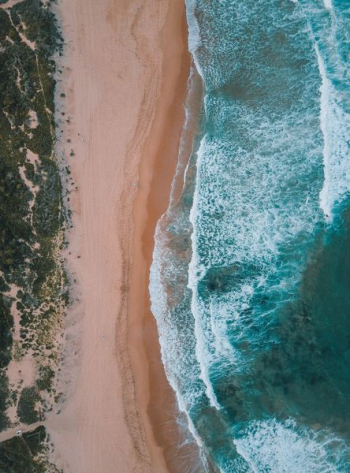 aerial view of beach with waves aerial view of beach with waves