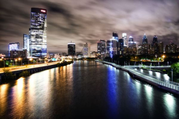 aerial view of city buildings and lake during nighttime aerial view of city buildings and lake during nighttime