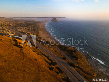 Aerial view of coastal road during sunset Aerial view of coastal road during sunset