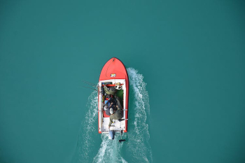 Aerial View of Fisherman on Boat Aerial View of Fisherman on Boat