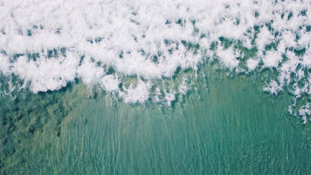 aerial view of waves on beach aerial view of waves on beach