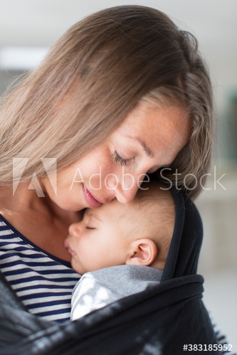 Affectionate tender mother cuddling baby son Affectionate tender mother cuddling baby son