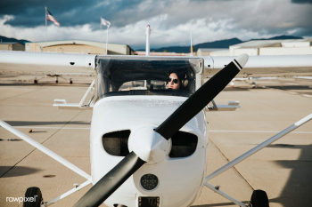 Airplane and pilot on the tarmac Airplane and pilot on the tarmac