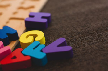 alphabet learning toy on gray apparel alphabet learning toy on gray apparel