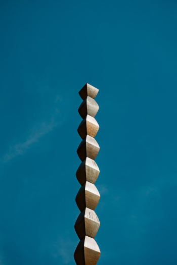An Elongated Wooden Carving An Elongated Wooden Carving