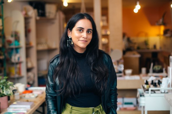 An Entrepreneur Standing In Her Store An Entrepreneur Standing In Her Store