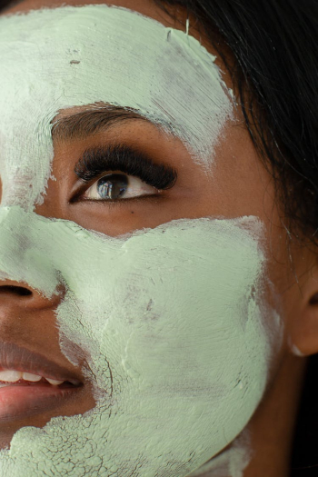 Anonymous black woman with clay mask Anonymous black woman with clay mask