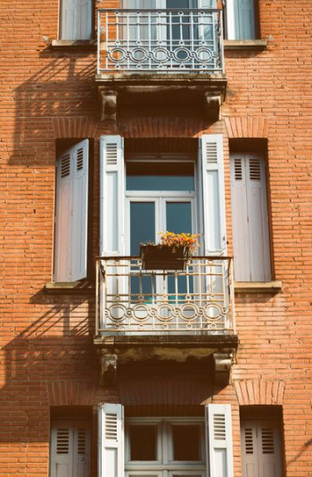 apartment window during daytime apartment window during daytime