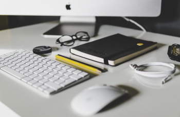 Apple Magic Keyboard and Apple Magic Mouse on white table Apple Magic Keyboard and Apple Magic Mouse on white table