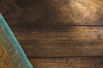 Arabic mat on wooden surface Arabic mat on wooden surface