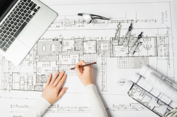 Architect drawing blueprint Architect drawing blueprint
