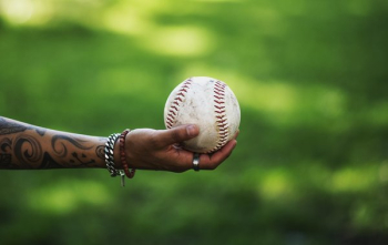 Arm Reaches Out Holding Softball Arm Reaches Out Holding Softball