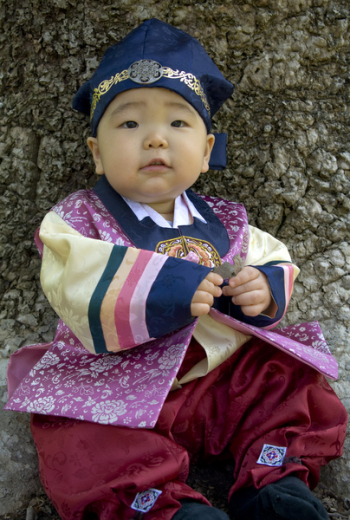 Asian baby, one year old child wearing the traditional Korean...