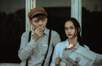 Asian Couple Standing Beside Window Asian Couple Standing Beside Window