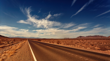 Asphalt Road Under White Clouds Asphalt Road Under White Clouds