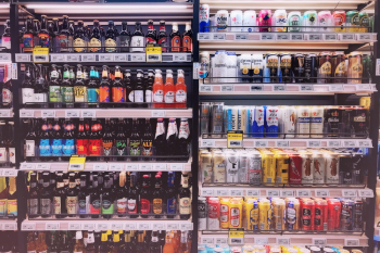 Assorted Bottles and Cans in Commercial Coolers Assorted Bottles and Cans in Commercial Coolers