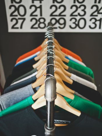 assorted-color hanged shirts with hangers assorted-color hanged shirts with hangers