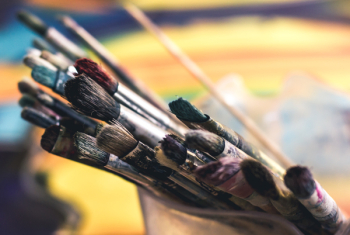 Assorted-color Paintbrushes on Container Selective Focus Photography