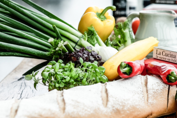 Assorted Vegetable and Bread on Brown Wooden Table Assorted Vegetable and Bread on Brown Wooden Table