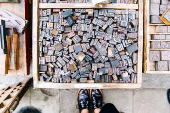 Assorted Wooden Alphabets Inside the Crate Assorted Wooden Alphabets Inside the Crate