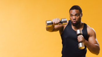 Athletic man exercising with weights Free Photo Athletic man exercising with weights Free Photo