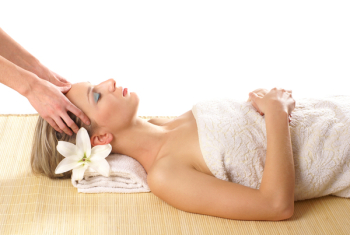 Attractive woman getting spa treatment isolated on white