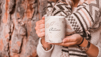 Autumn concept with woman holding mug