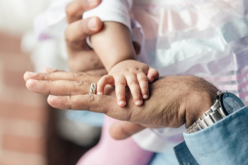 Baby Girls Hand On Dads Hand Baby Girls Hand On Dads Hand