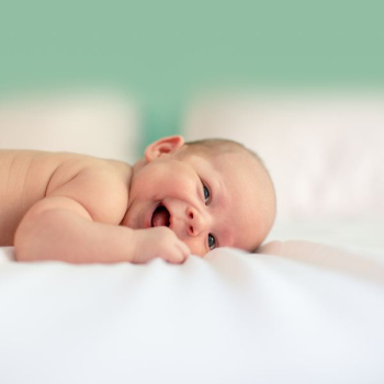 baby lying on fabric cloth baby lying on fabric cloth