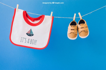 Baby mockup with bib and shoes on clothes line