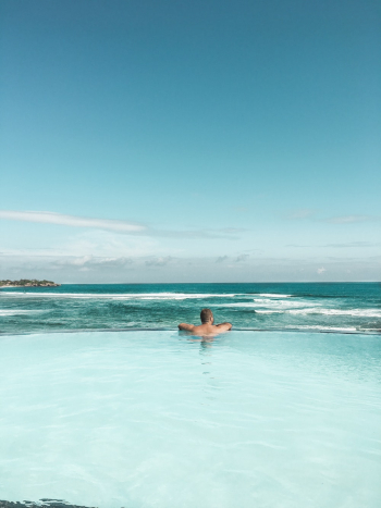 Back View of Man in Swimming Pool Back View of Man in Swimming Pool