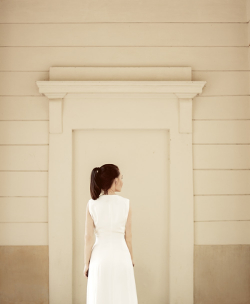 Back View Of Woman In White Sleeveless Dress
